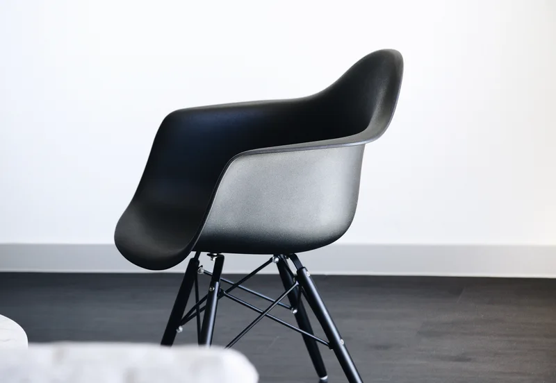 A chair photographed in a room, before background removal